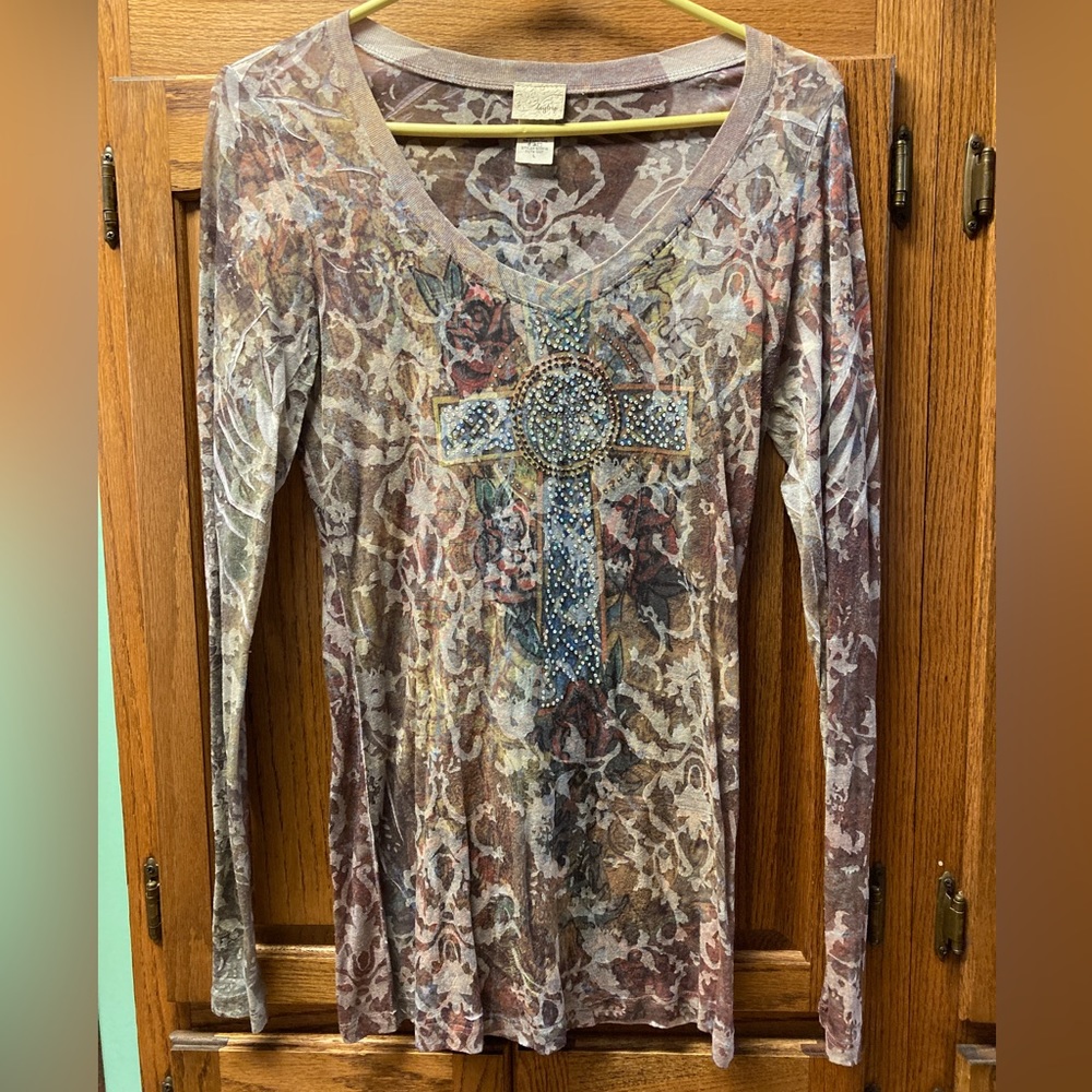 Long sleeved, sheer daytrip top.